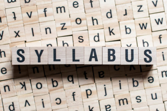 ‘Syllabus’ spelled out in wooden blocks.