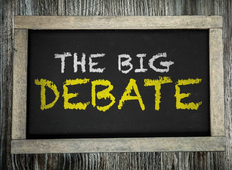 The words “The Big Debate” written on a chalkboard